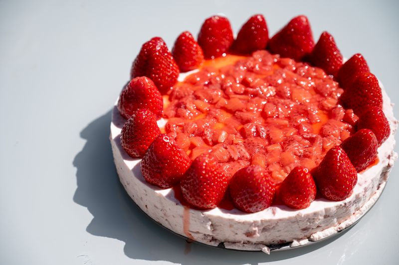 New York Cheesecake slice with fresh strawberry topping
